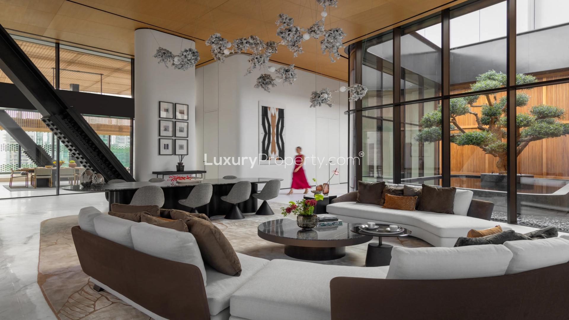 Ultra-modern living room in Zaha Hadid penthouse, featuring elegant decor and garden view
