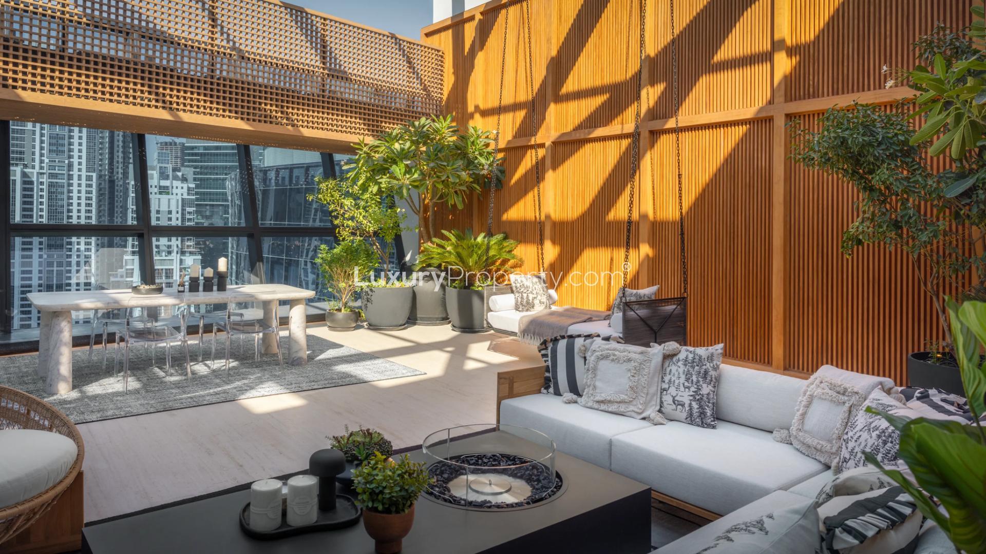 Luxurious penthouse terrace with modern seating and city views in Business Bay, The Opus