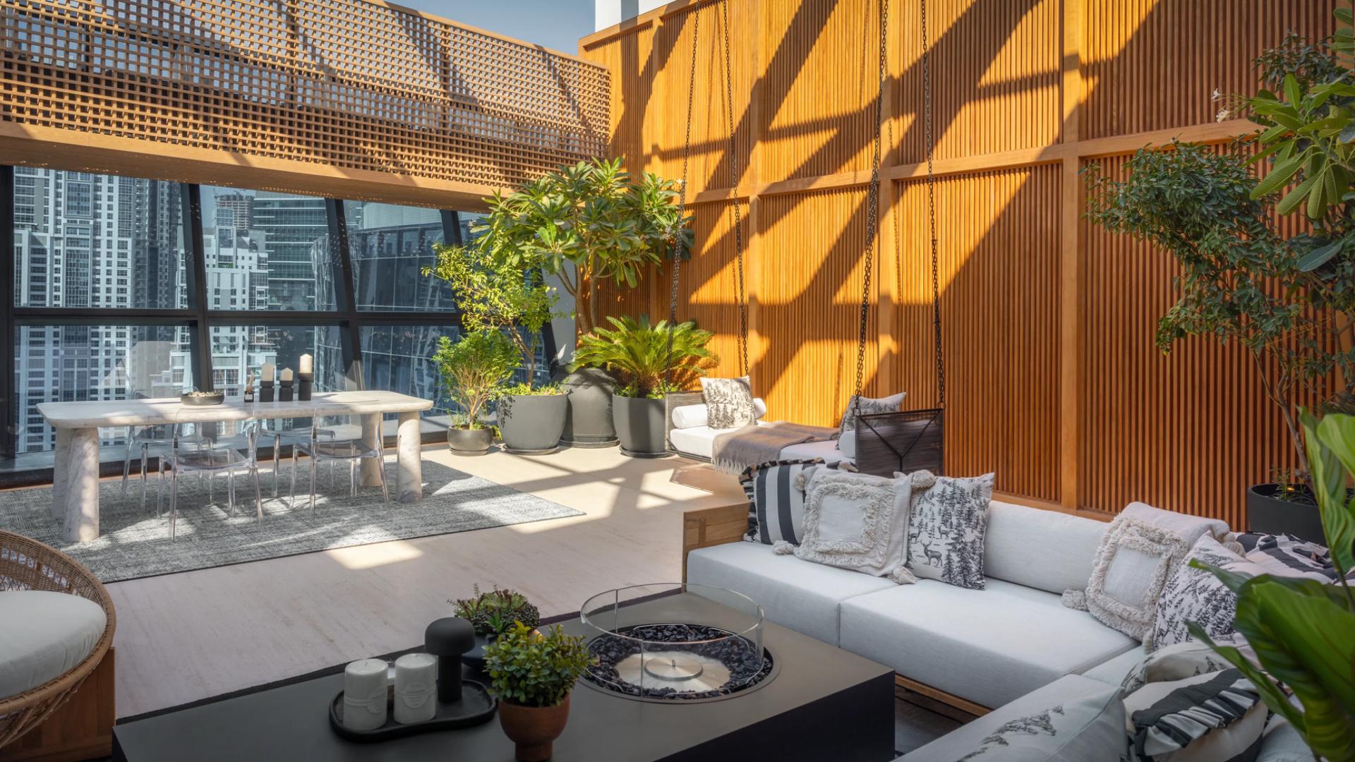 Luxurious penthouse terrace with modern seating and city views in Business Bay, The Opus