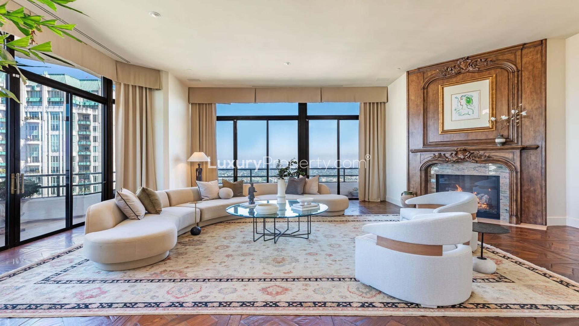 Luxurious penthouse entryway with marble floors and elegant decor on Wilshire Corridor
