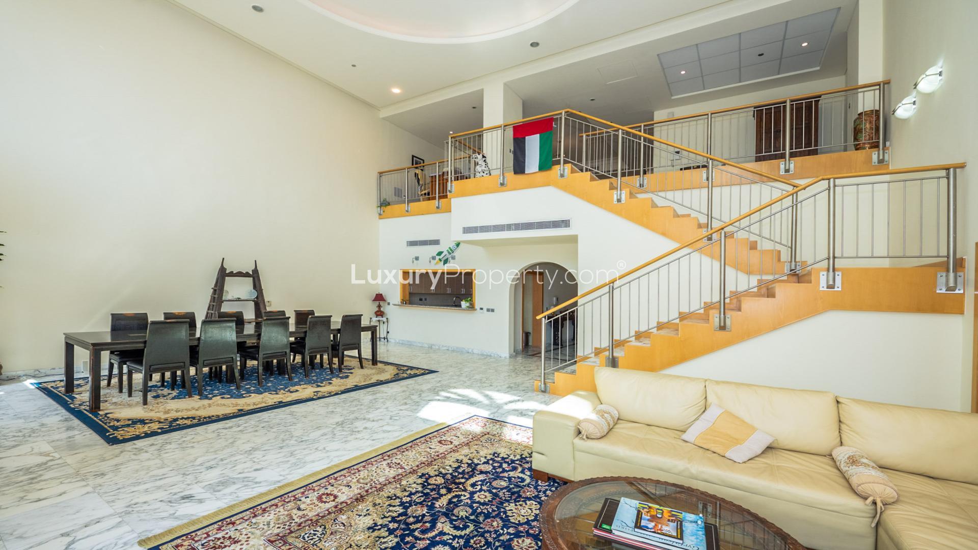 Aerial view of Shoreline Apartments, Palm Jumeirah with cityscape and greenery