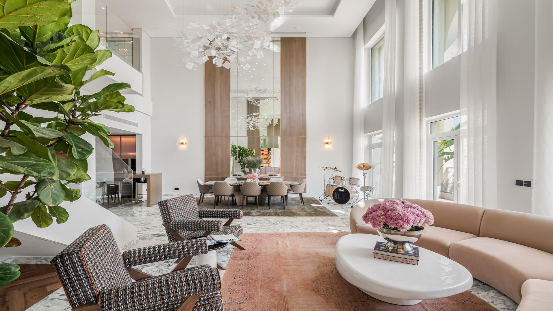 Luxurious living room in Viola Penthouse, Palm Jumeirah, with elegant decor and staircase