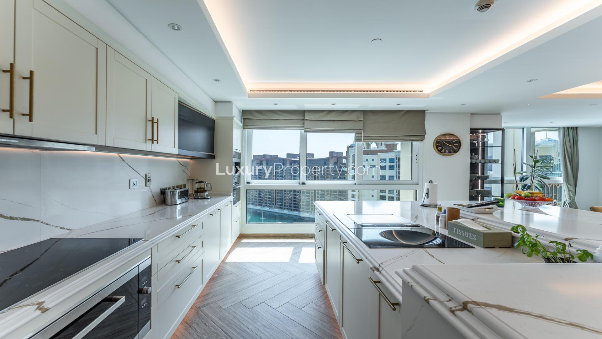 Luxurious living room in Palm Jumeirah penthouse with modern decor and high ceilings