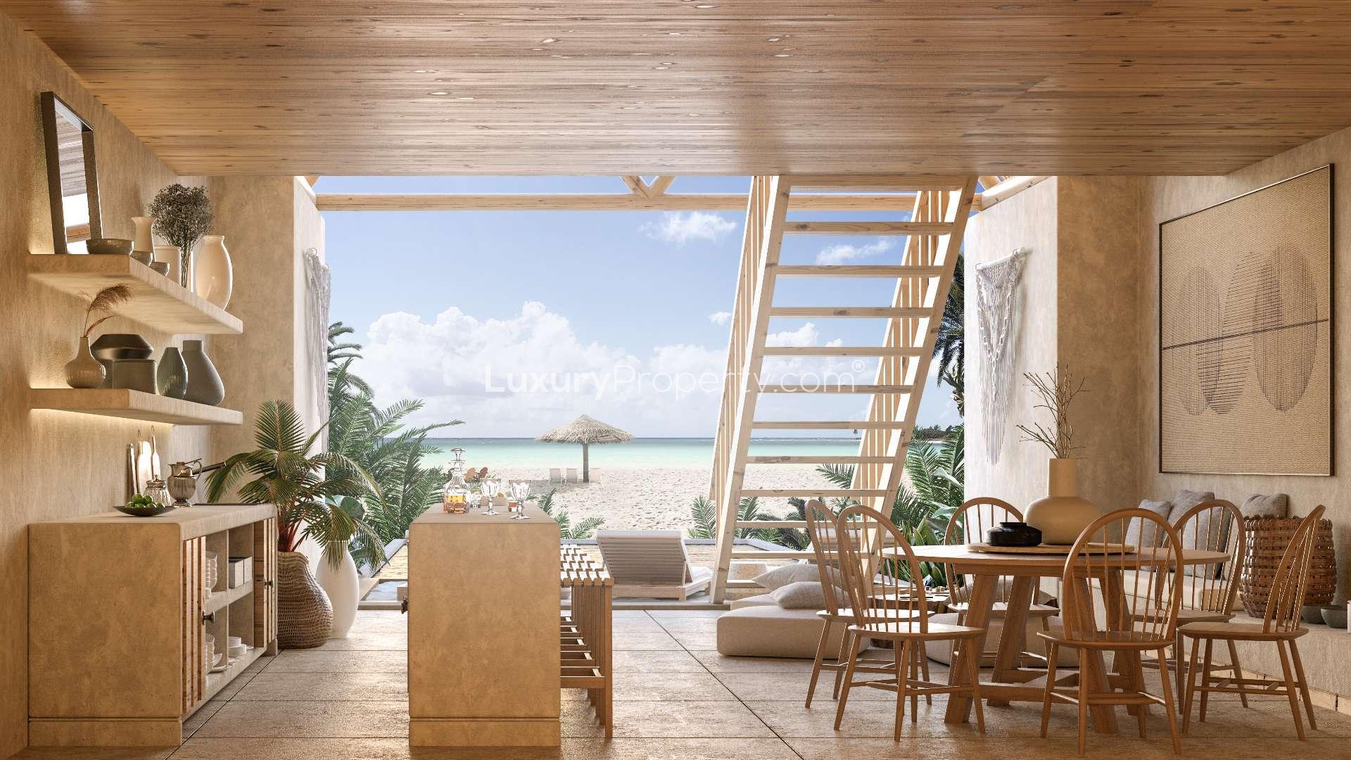 Modern dining area in Corasol Riviera Maya penthouse, featuring elegant decor and natural tones