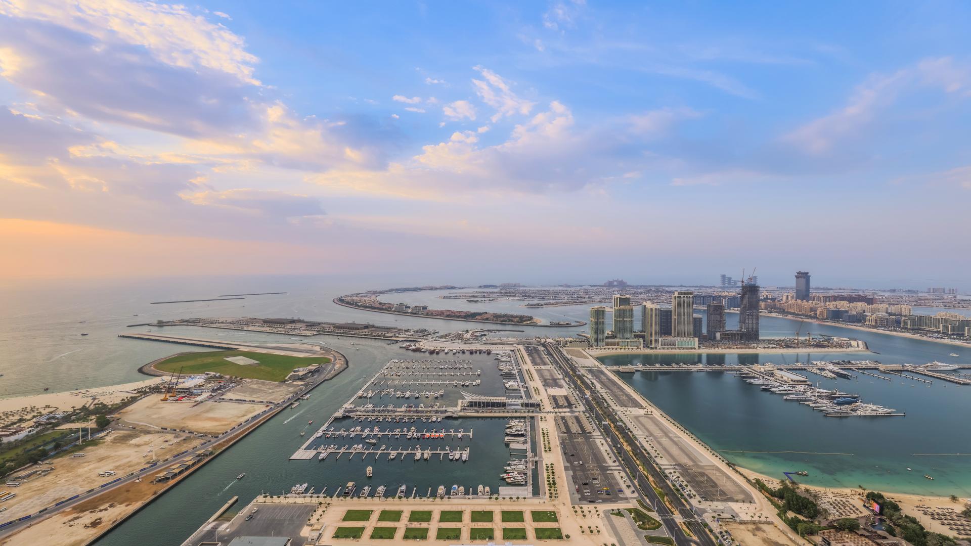 Luxurious penthouse interior with modern decor, spacious dining area, and elegant lighting in Dubai Marina