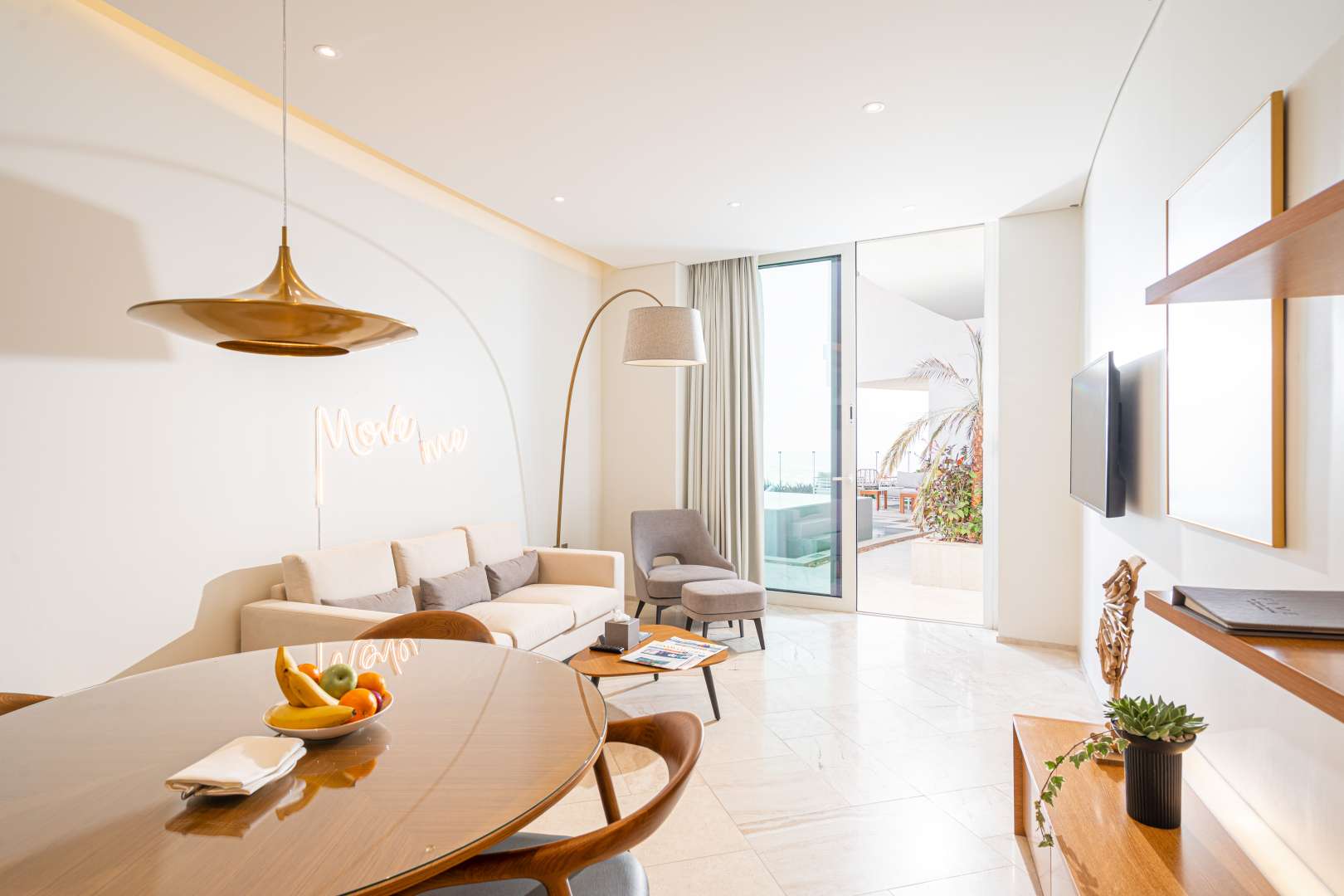 Modern kitchen in 4-bedroom penthouse, Jumeirah Village Circle, with sleek cabinetry and appliances