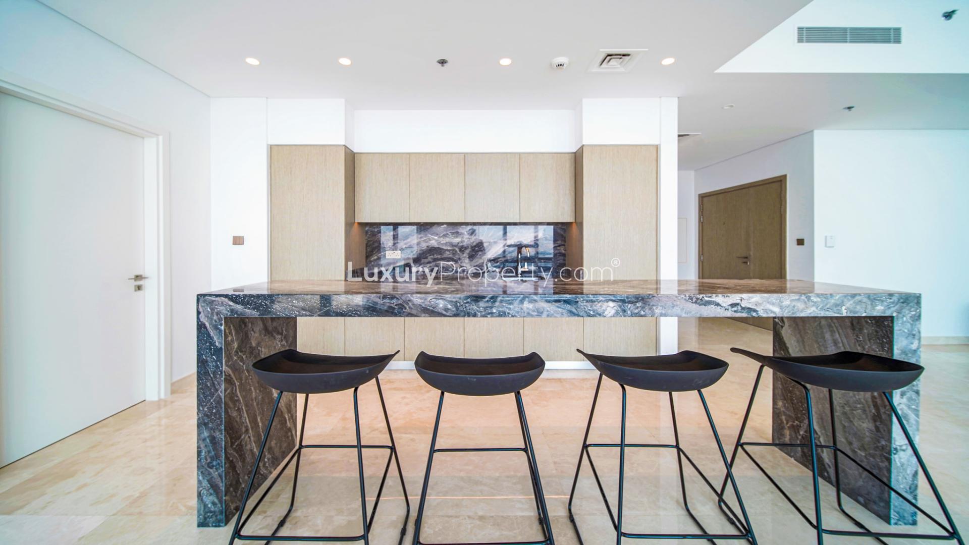 High floor apartment interior with modern kitchen in Dubai Creek Harbour's The Grand