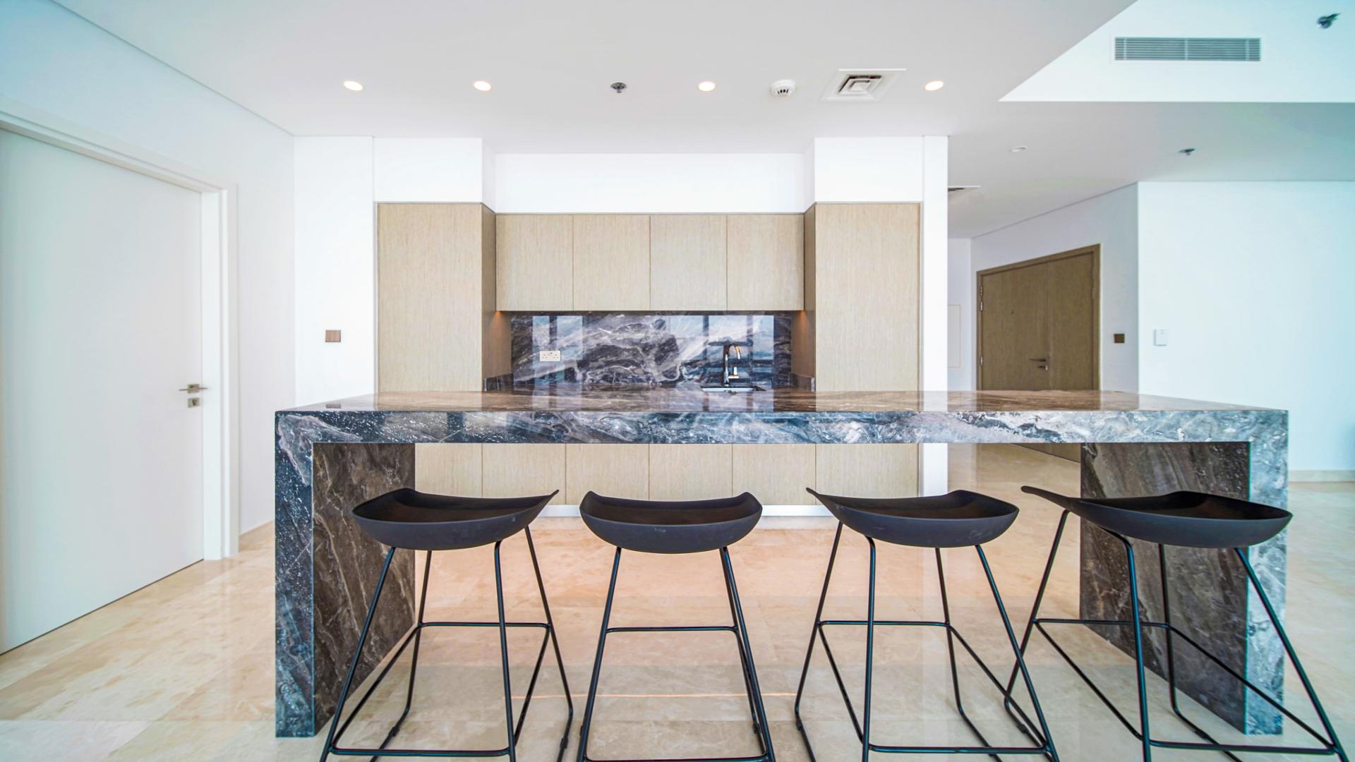 High floor apartment interior with modern kitchen in Dubai Creek Harbour's The Grand