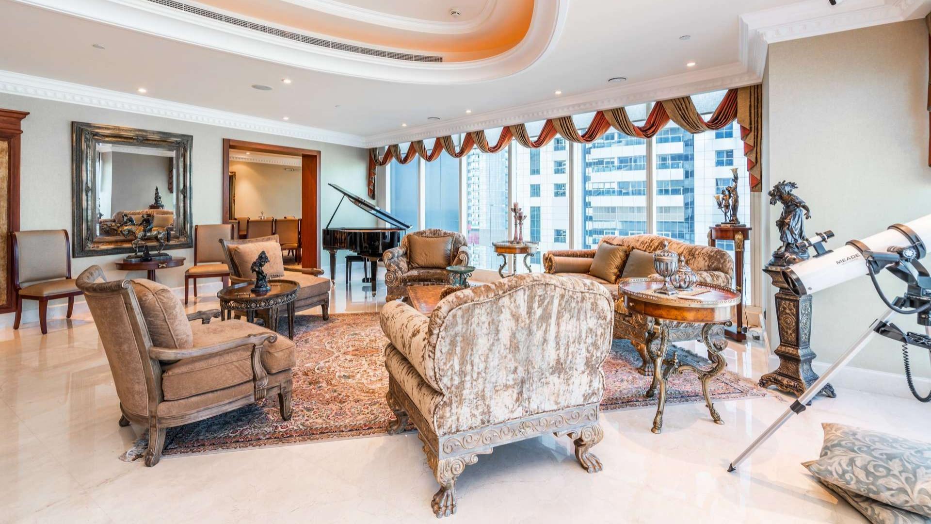 Luxurious kitchen in 4-bedroom penthouse, Le Reve, Dubai Marina, with modern appliances and island