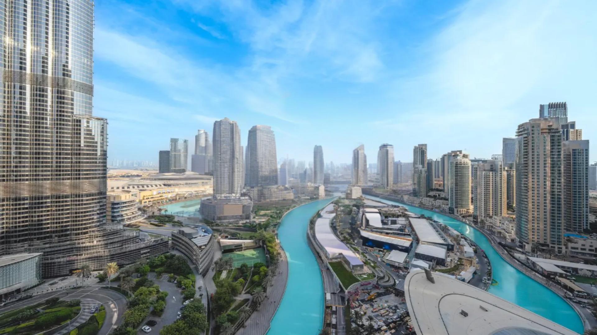 Spacious IL Primo penthouse with city skyline view, marble floors, and modern ceiling design