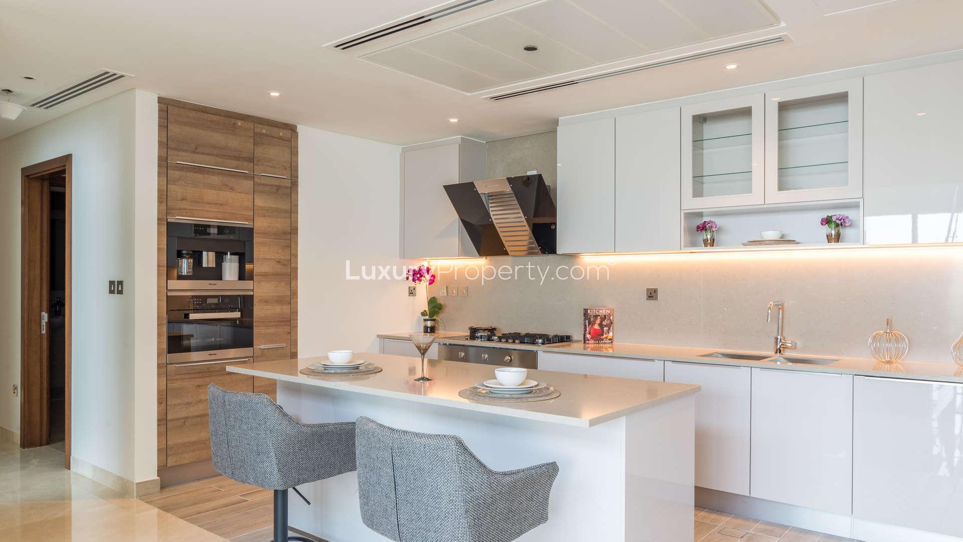 Contemporary living room in four-bedroom penthouse, Marina Gate, Dubai Marina, with city views