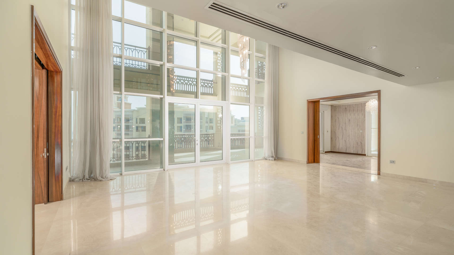 Furnished duplex penthouse interior with chandelier and Atlantic view in Marina Residences