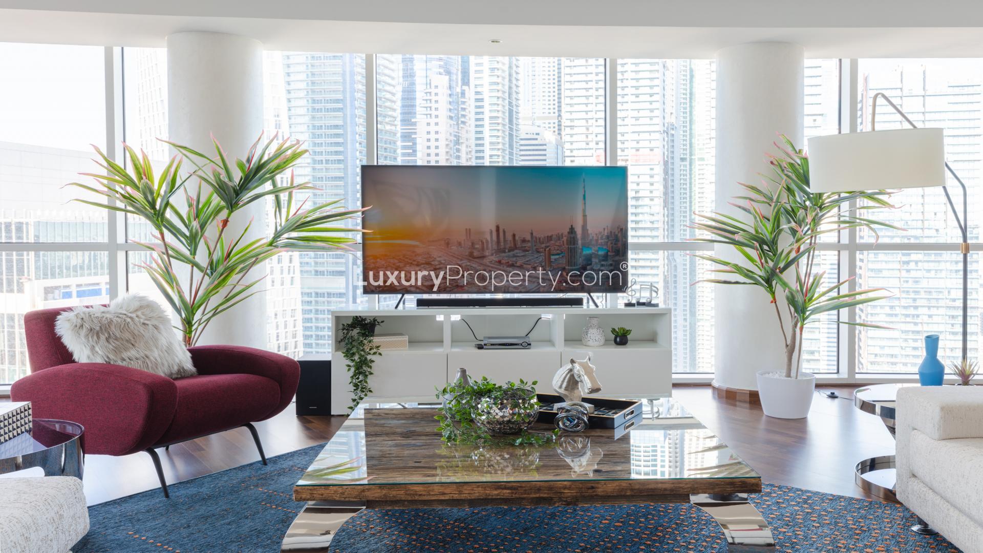 Luxurious living room in Marina Tower penthouse, Dubai Marina, with modern decor and spacious layout