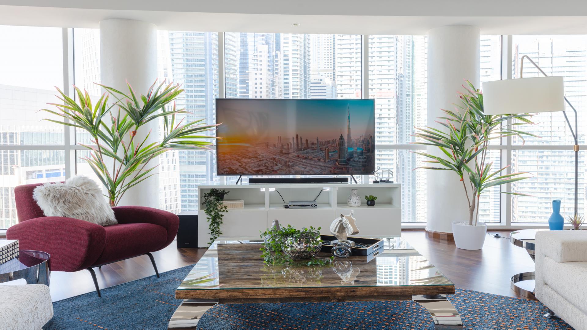 Luxurious living room in Marina Tower penthouse, Dubai Marina, with modern decor and spacious layout