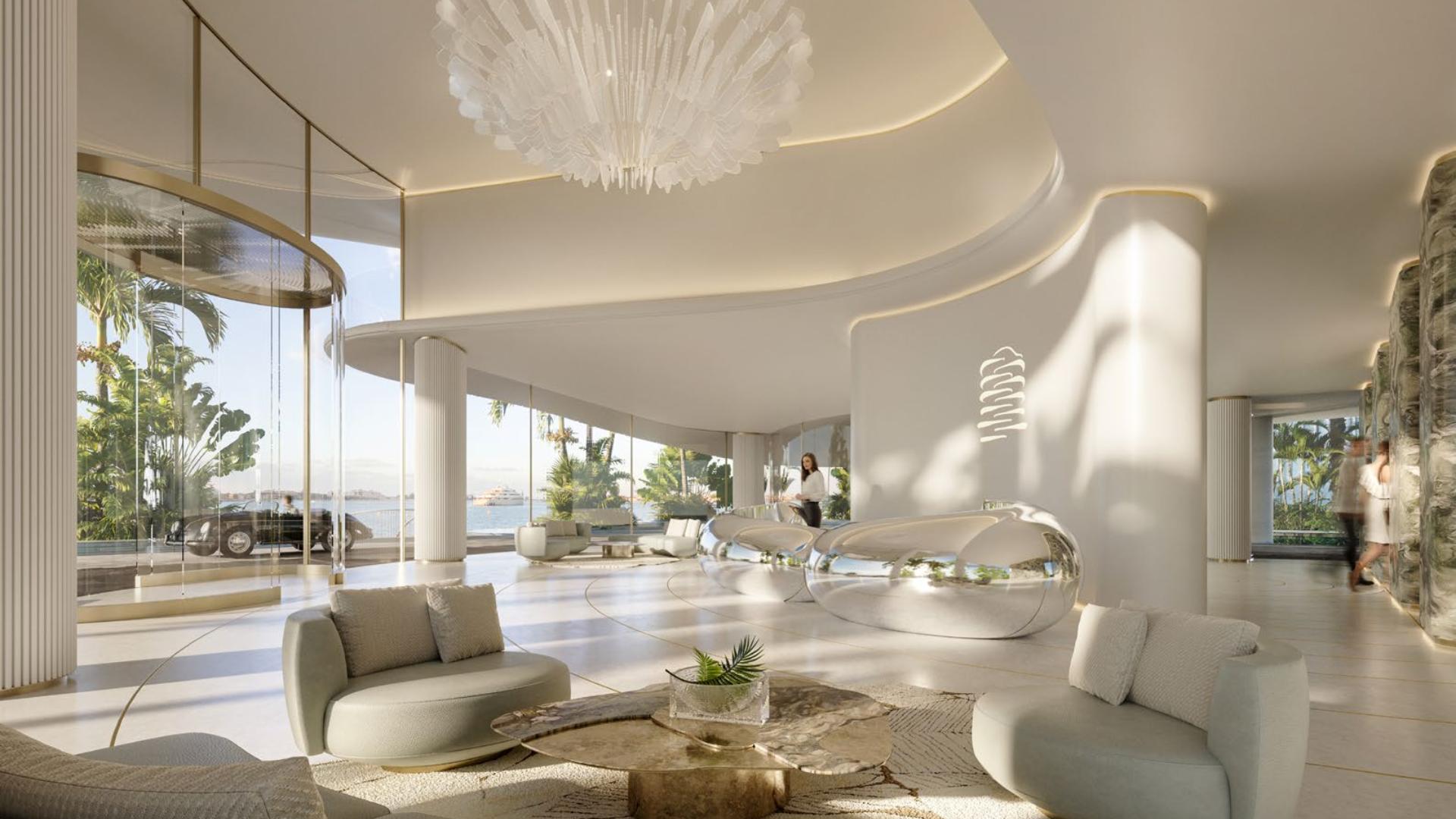 Luxurious living room in Palm Jumeirah penthouse with elegant decor and spiral staircase