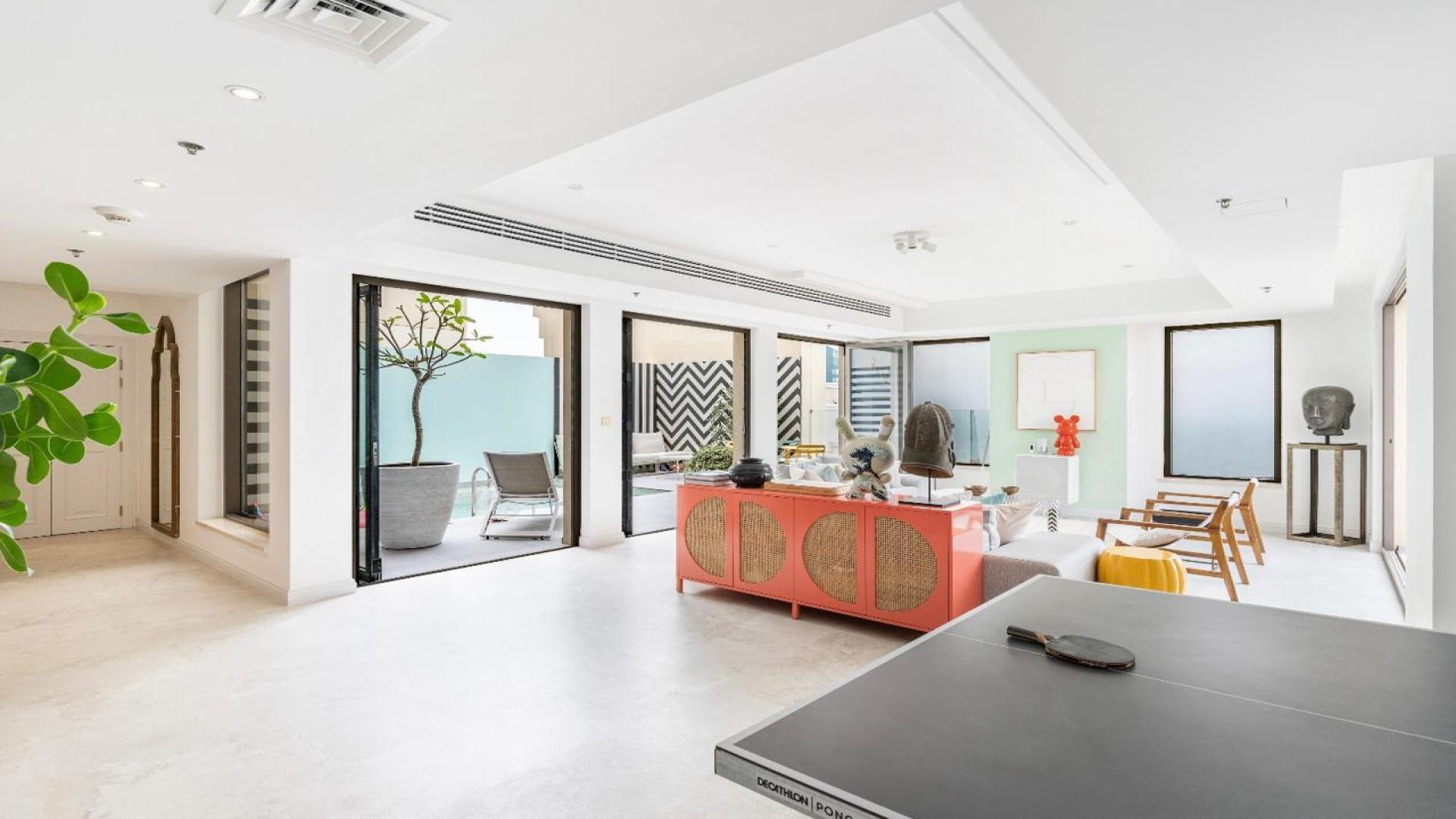 Luxurious JBR Shams 1 penthouse terrace with stunning sea views and elegant seating