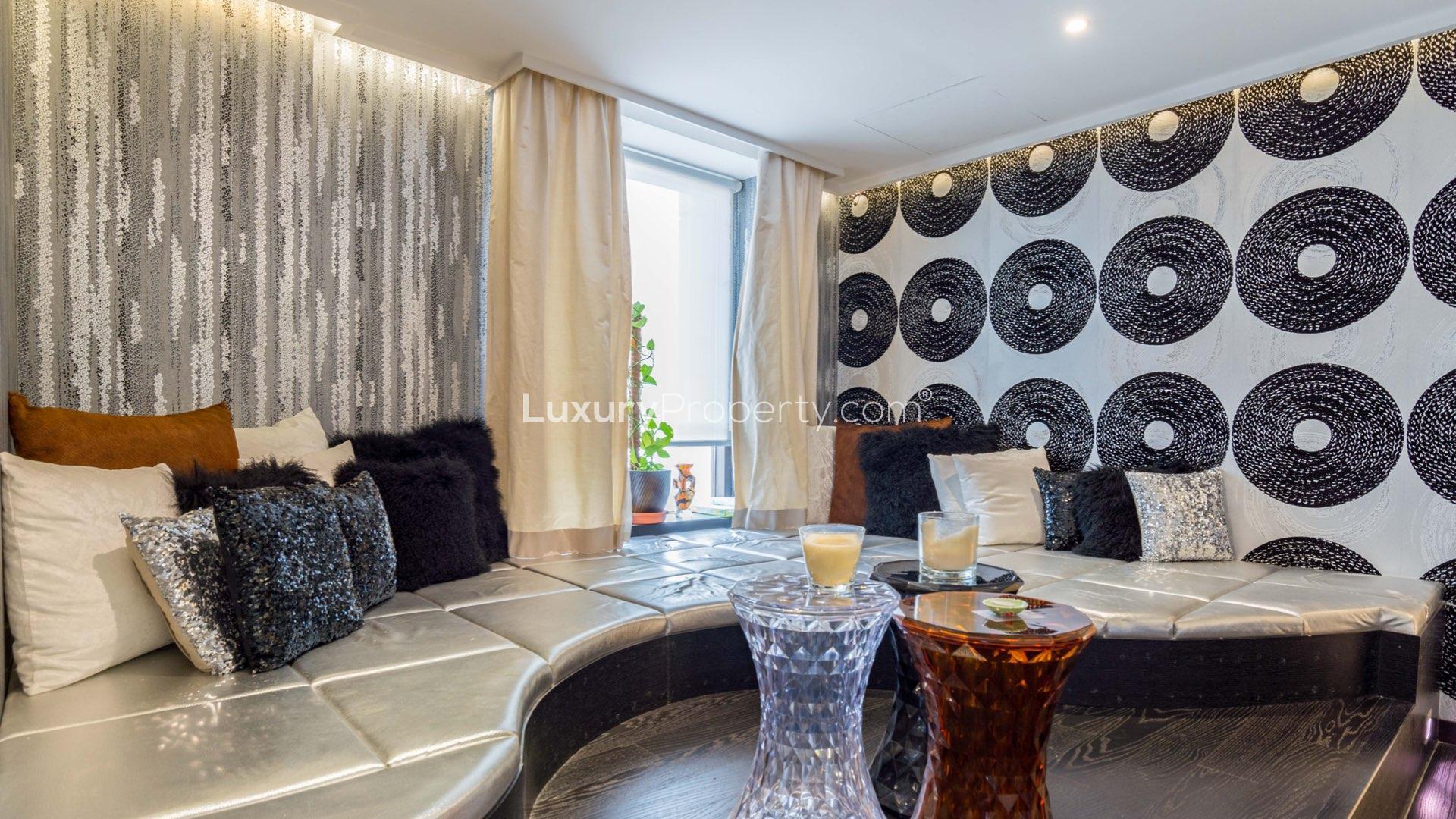 Luxurious dining area in Jumeirah Beach Residence penthouse with elegant decor and chandelier