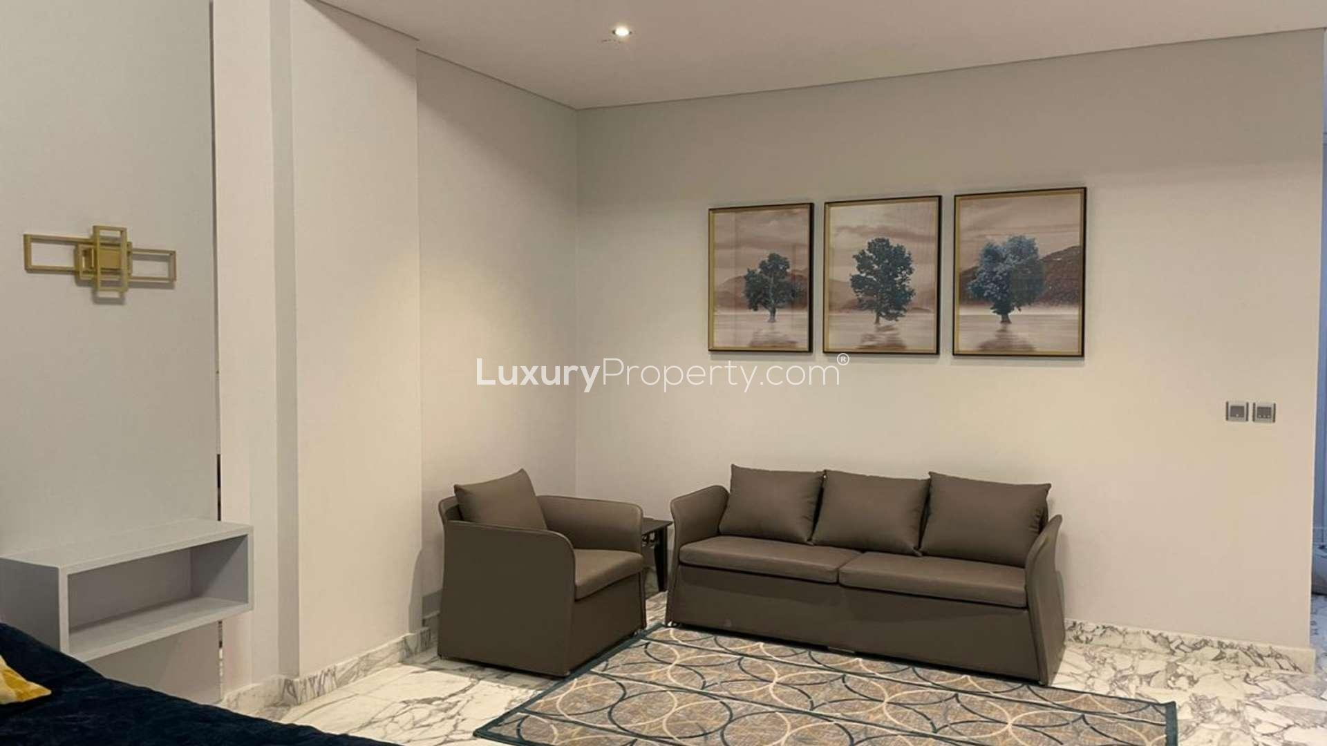 "Spacious living area in renovated four-bed duplex penthouse, Shoreline Apartments, Palm Jumeirah.",Living area in fully renovated penthouse, Shoreline Apartments, Palm Jumeirah. Modern decor and seating