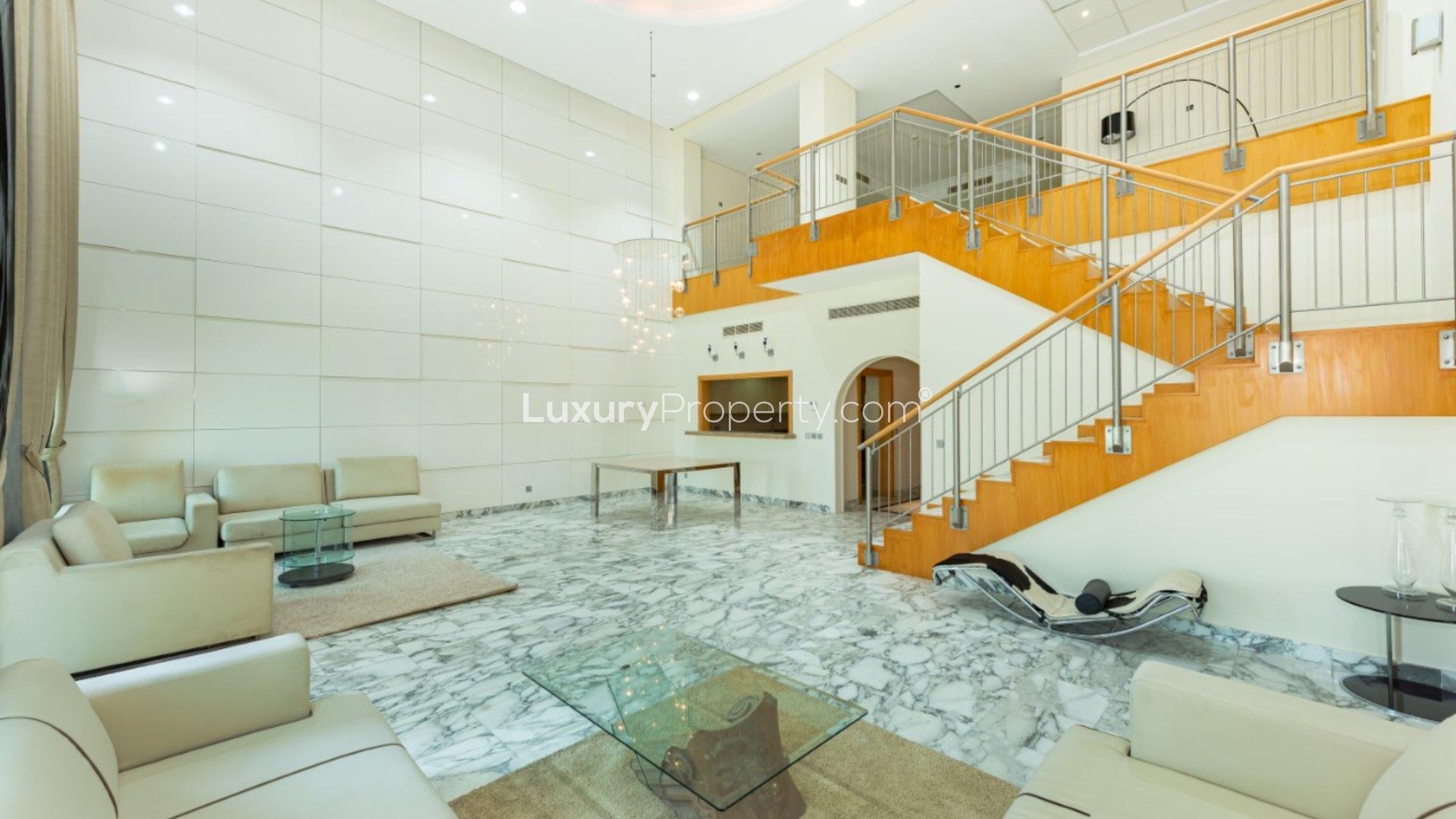 Luxurious duplex penthouse living area with sea view, modern decor, Palm Jumeirah