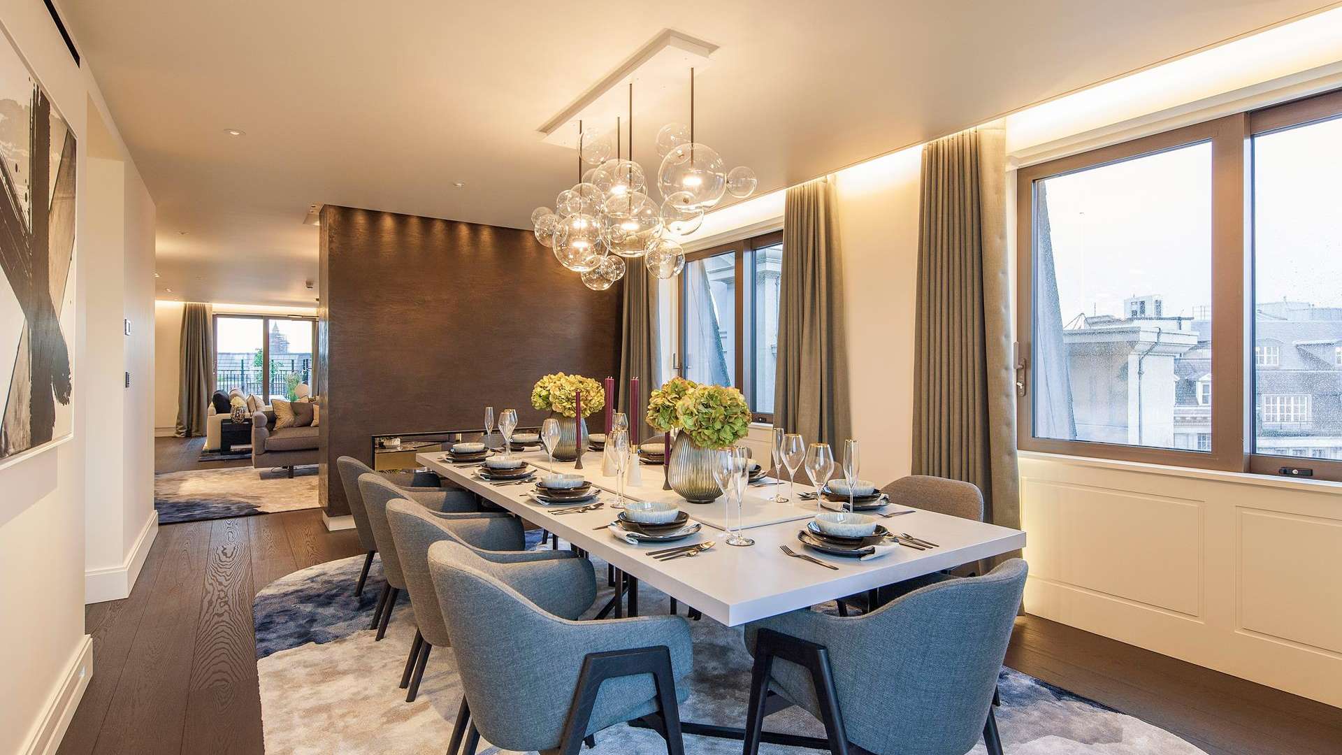 "Spacious rooftop terrace with city views, 4-bedroom penthouse, West End London, St Jamess Park.",Luxurious dining area in 4-bedroom penthouse, West End London, St James's Park view