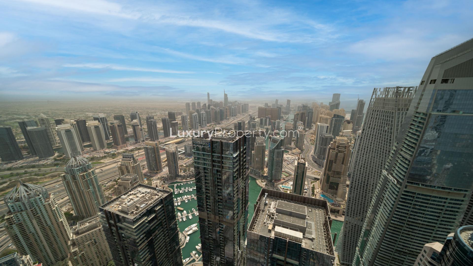 Aerial view of Dubai Marina skyline from elegant four-bedroom penthouse in The Torch