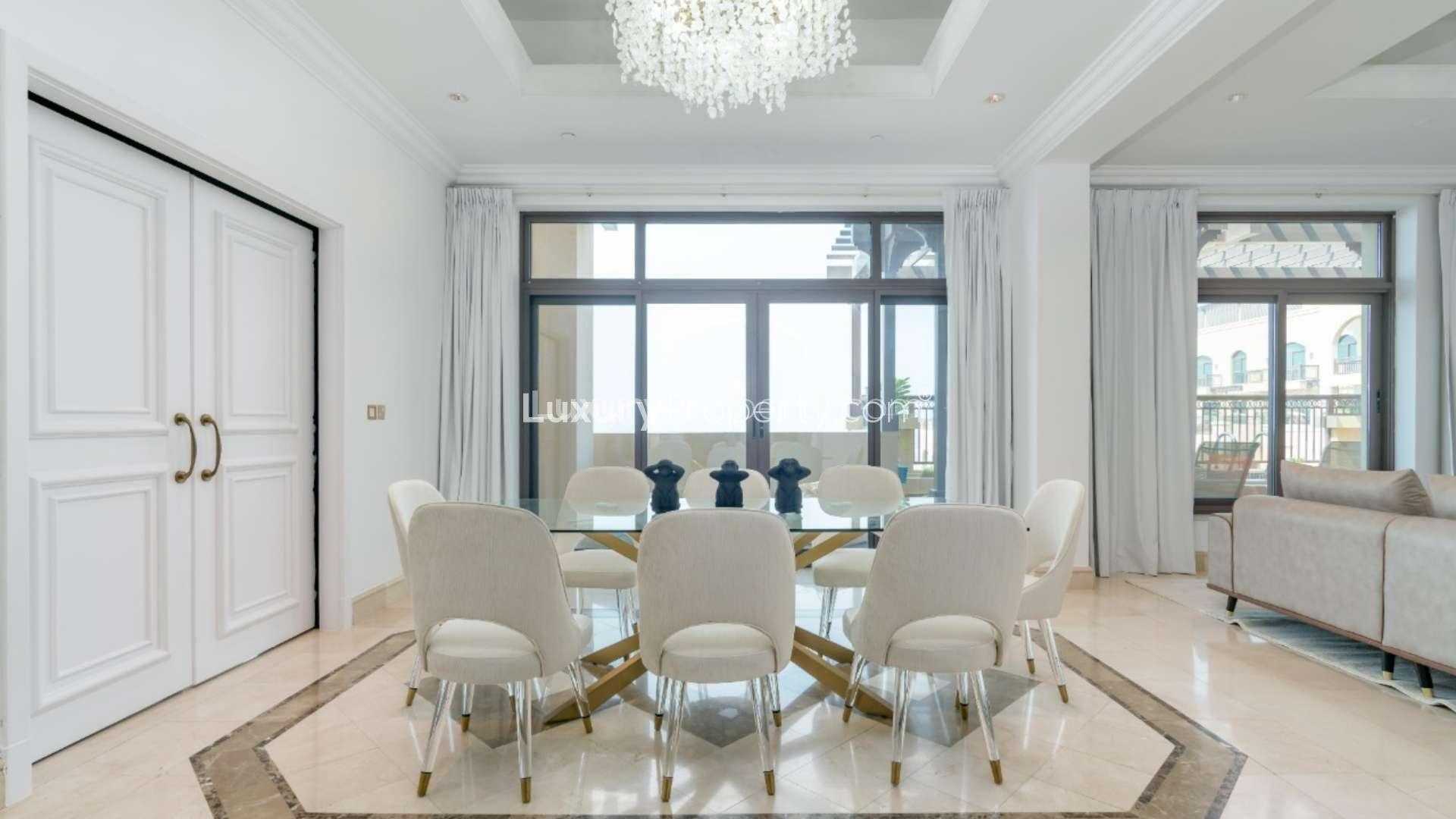 Furnished living area in upgraded Palm Jumeirah penthouse, featuring modern decor and fireplace