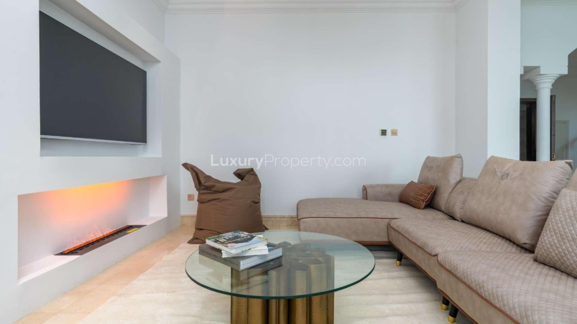 Luxurious living room in furnished Palm Jumeirah penthouse, featuring elegant decor and chic seating