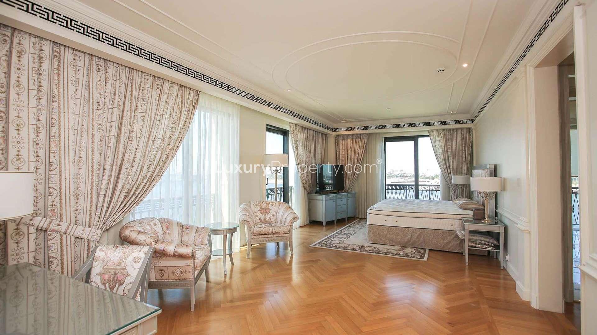 Outdoor pool area at Palazzo Versace apartment in Culture Village, Dubai. Luxurious amenities featured