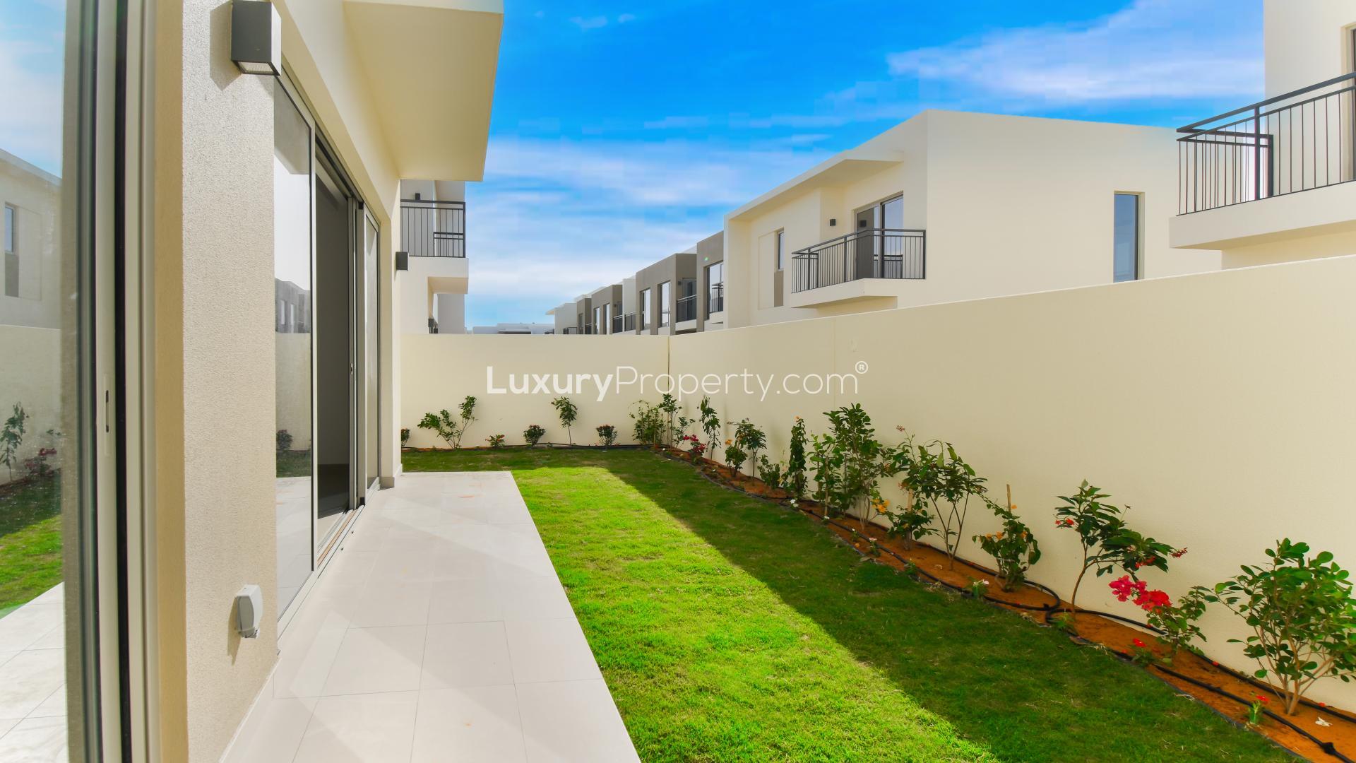 Bright modern kitchen in Camelia townhouse, Arabian Ranches 2, with garden view