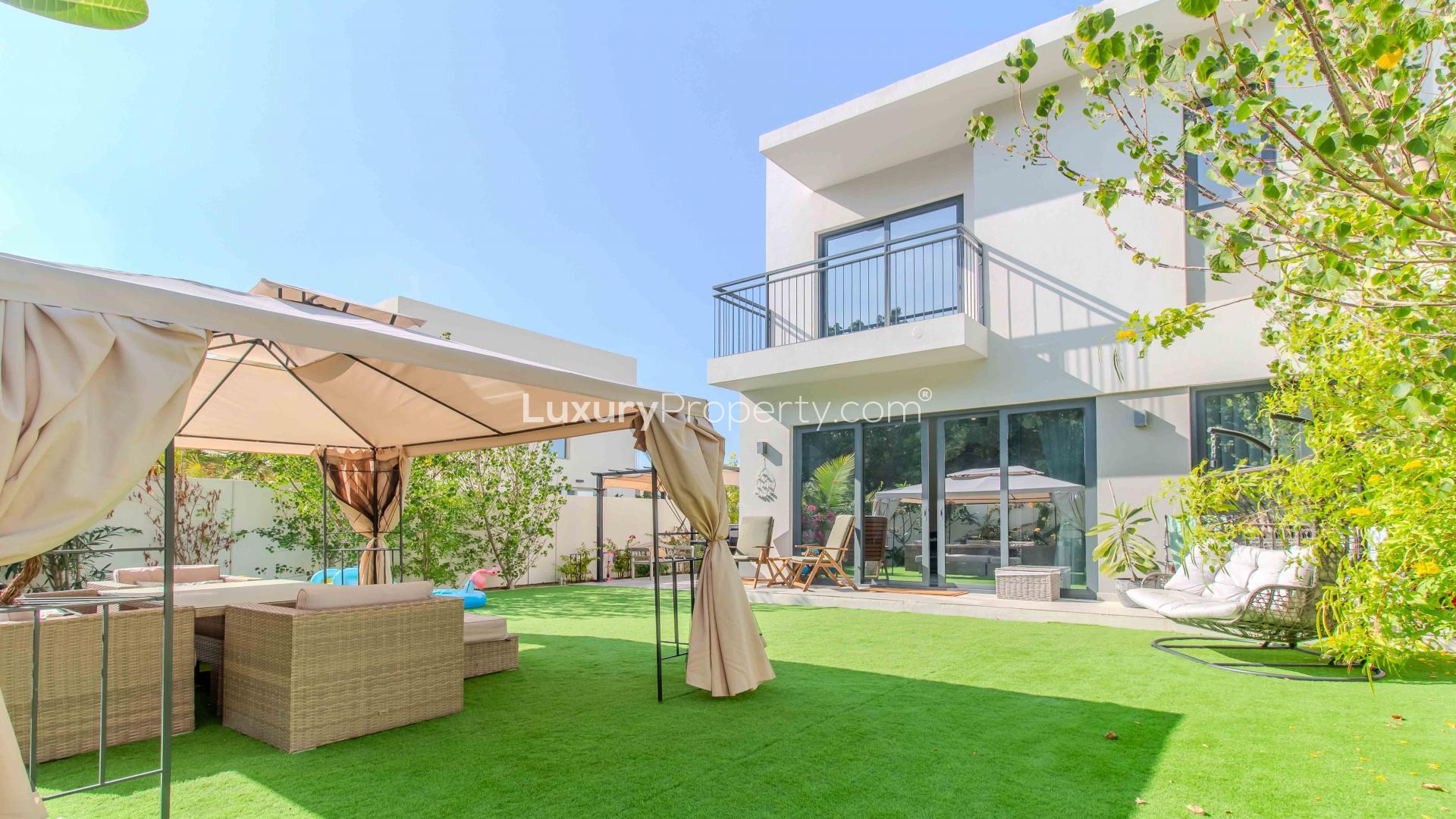 Charming living room in Camelia townhouse, Arabian Ranches 2, with garden view and cozy decor