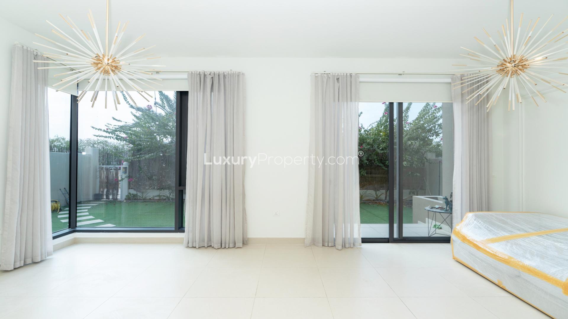 Modern kitchen in Dubai Hills Estate townhouse, featuring sleek design and natural light