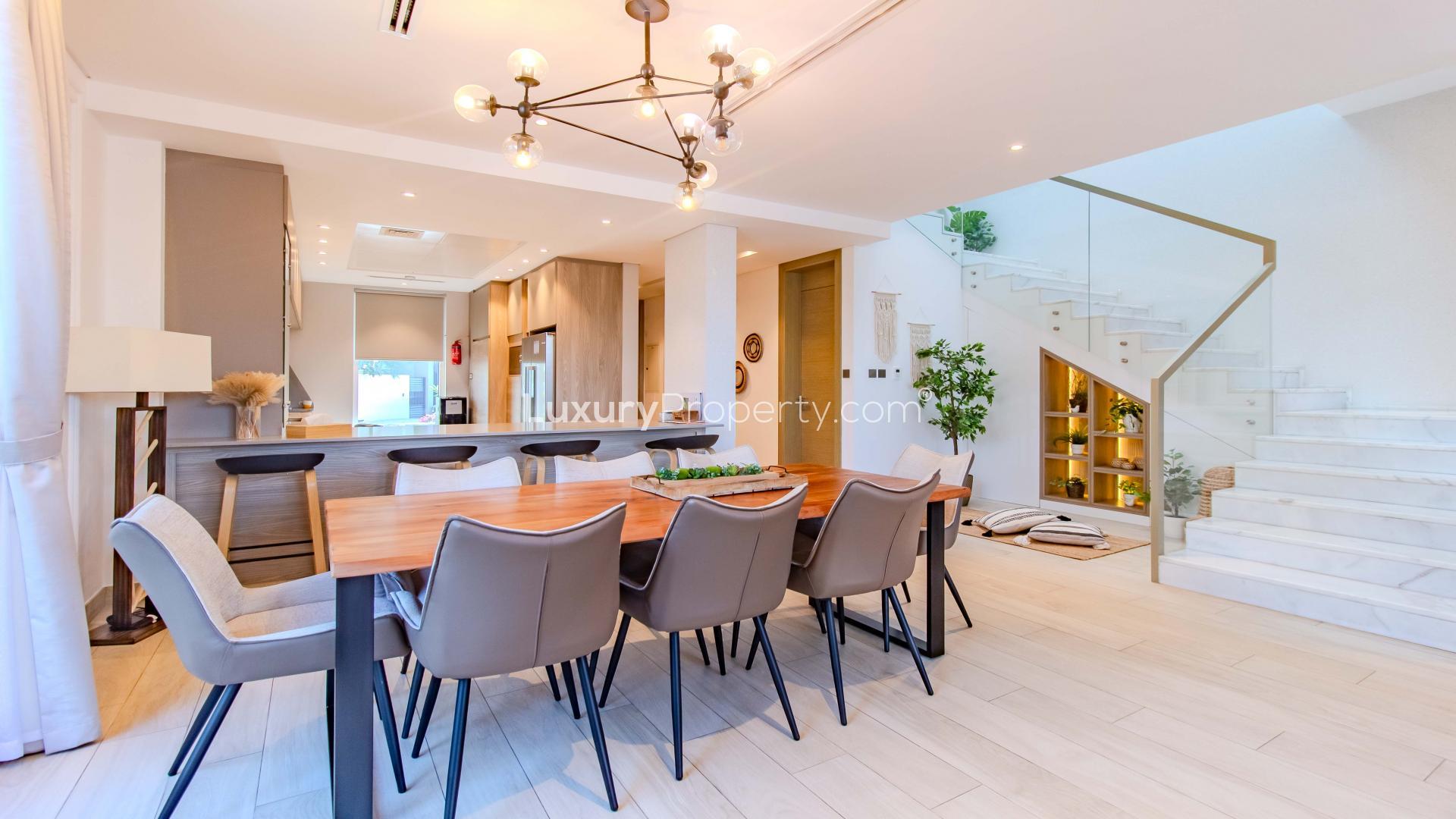 Bright living room in Jumeirah Park villa, featuring modern decor and garden view