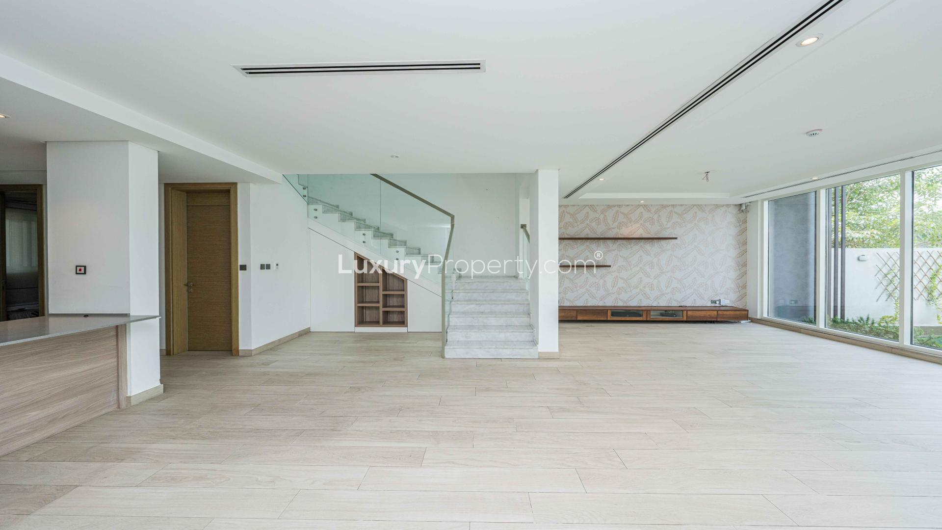 Spacious living area in 4-bedroom townhouse, Jumeirah Park, featuring modern open-plan design