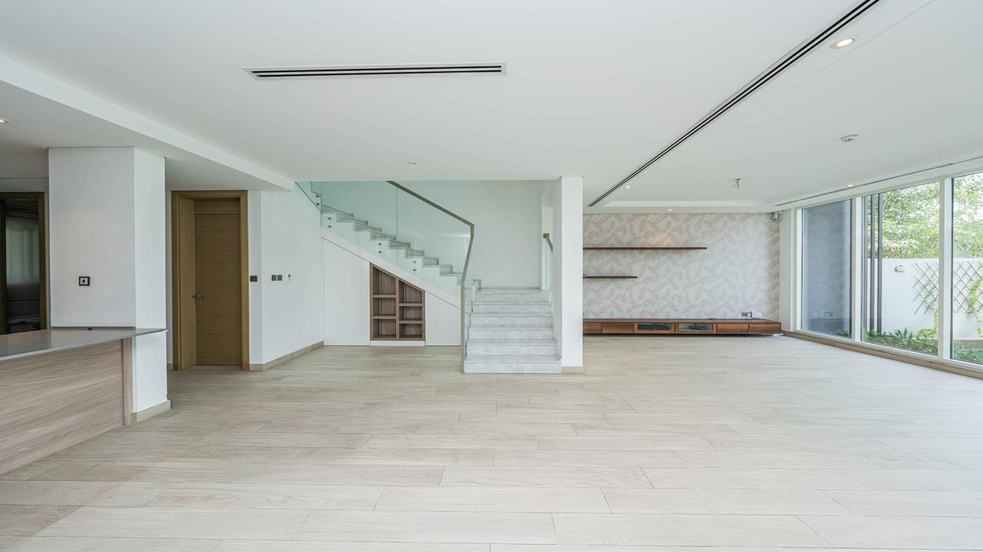 Spacious living area in 4-bedroom townhouse, Jumeirah Park, featuring modern open-plan design