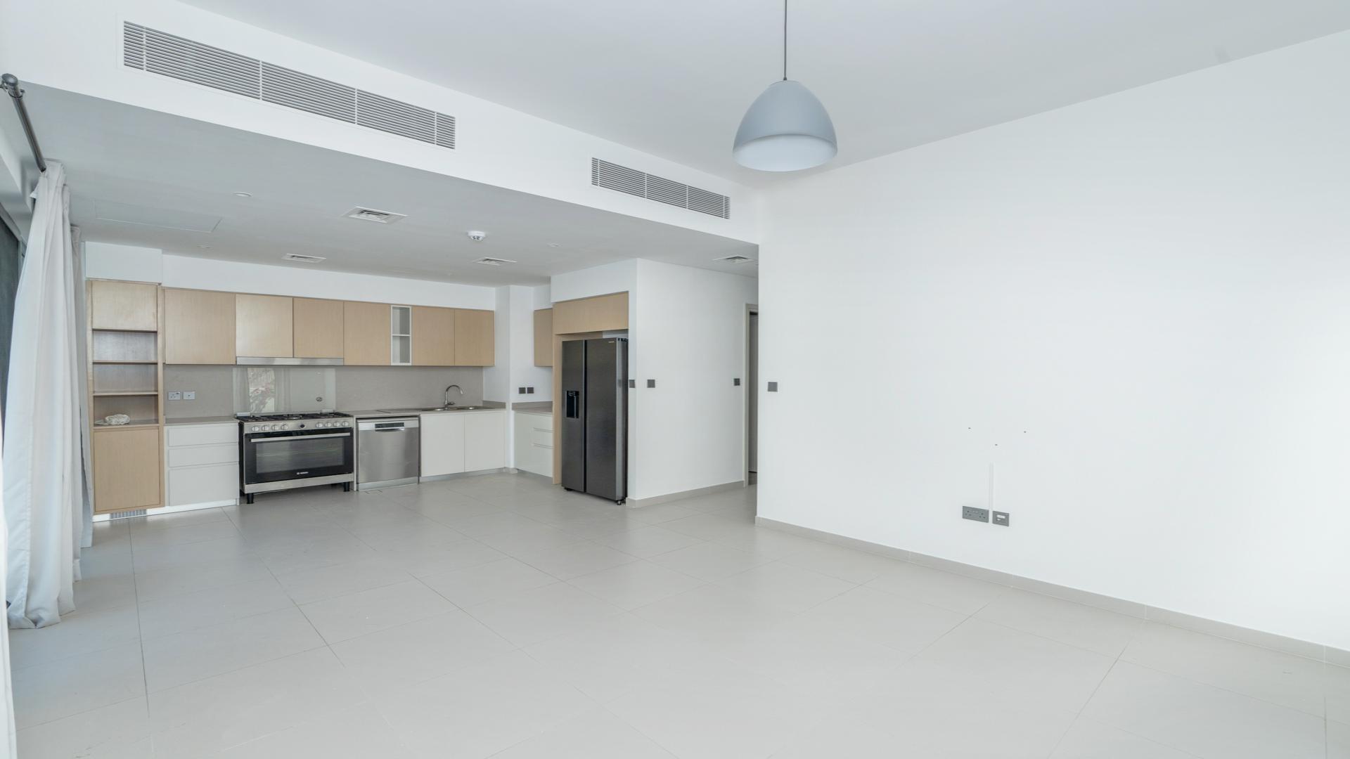 Exterior view of modern 4-bedroom townhouse in Arabian Ranches 3, Sun community