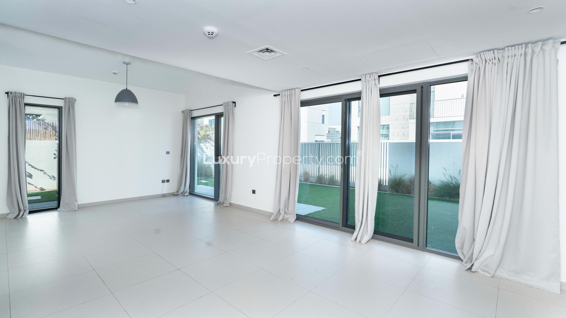 Modern living room with large windows in Arabian Ranches 3 townhouse, Sun sub-community