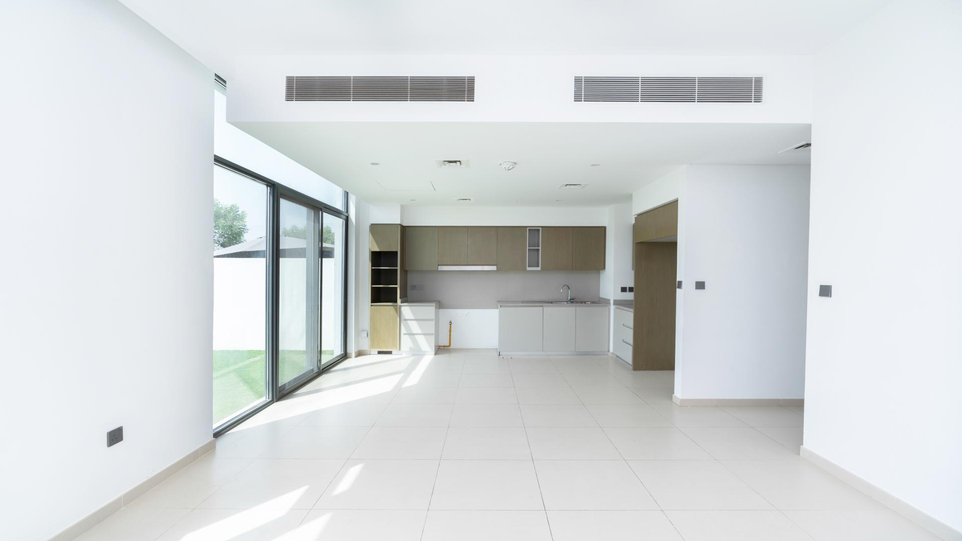 Modern kitchen and living area in Spring townhouse, Arabian Ranches 3, for rent