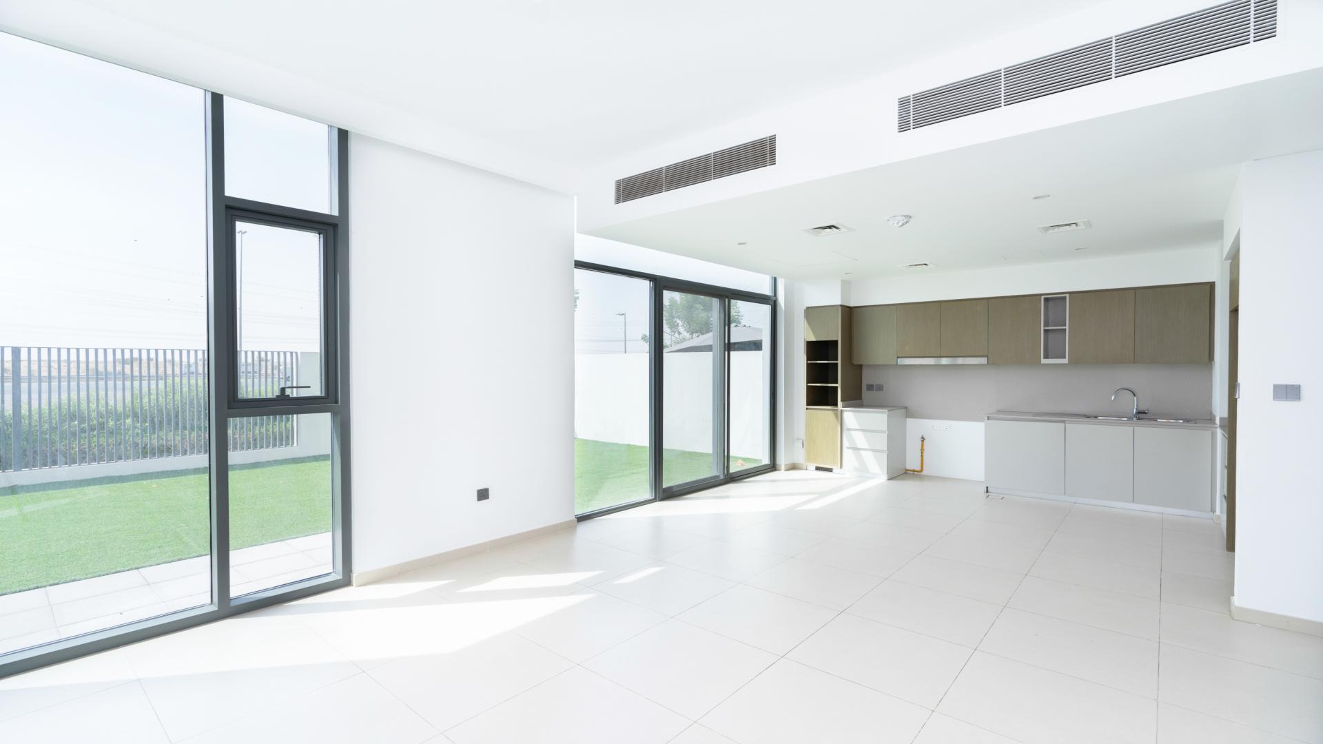 Modern townhouse entrance with covered patio at Spring, Arabian Ranches 3 community