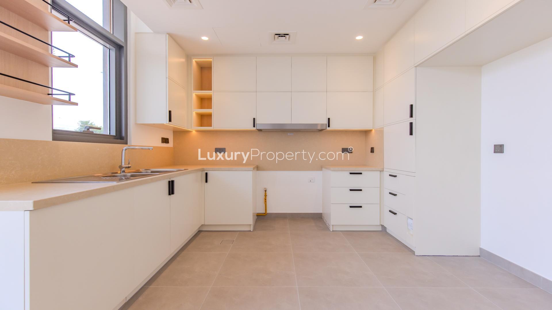 Modern kitchen and living area in 4-bedroom townhouse, Arabian Ranches 3, Ruba community