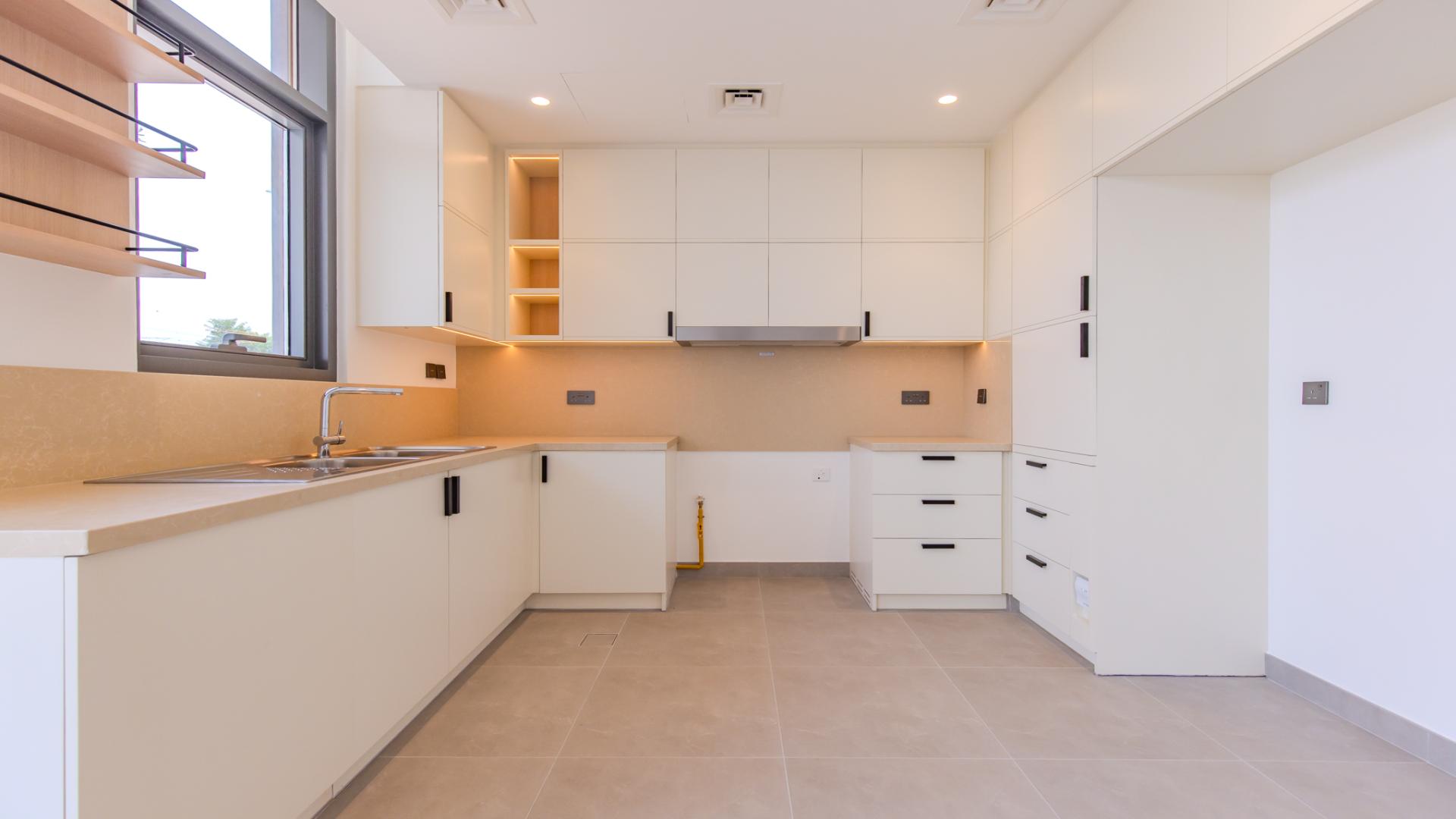 Modern kitchen and living area in 4-bedroom townhouse, Arabian Ranches 3, Ruba community