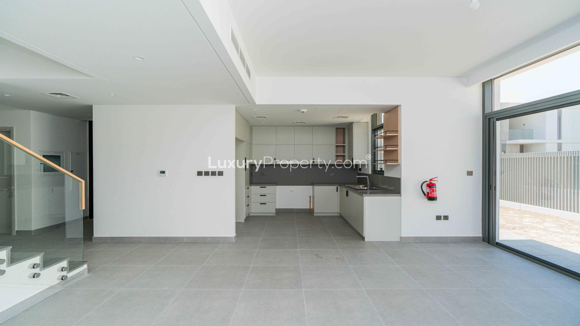 Spacious modern townhouse exterior in Ruba, Arabian Ranches 3, with landscaped front view
