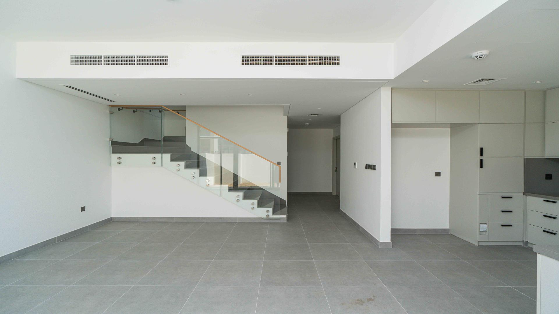 Modern kitchen in spacious Ruba townhouse, Arabian Ranches 3, with open layout and sleek design