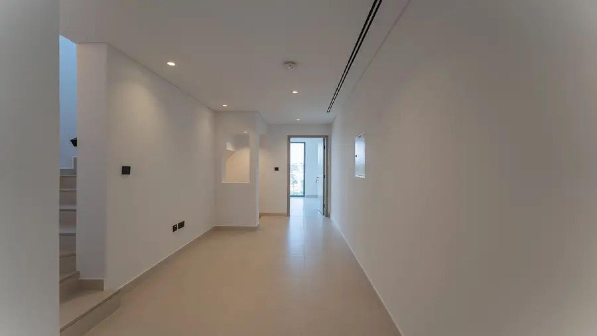 Modern open-plan living area in eco-friendly villa, Tilal Al Ghaf, Aura community