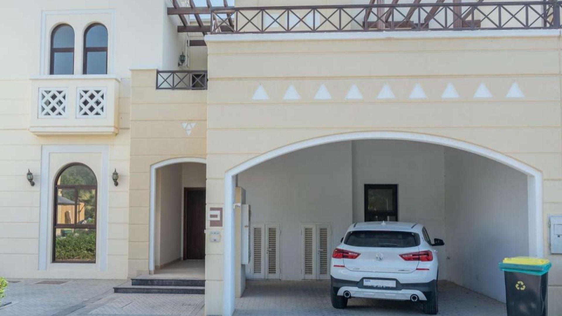 "Spacious rooftop terrace in Mudon Al Salam townhouse for rent, 4 bed + maid, vacant.",Front view of 4-bedroom townhouse with garage in Al Salam, Mudon, available for rent