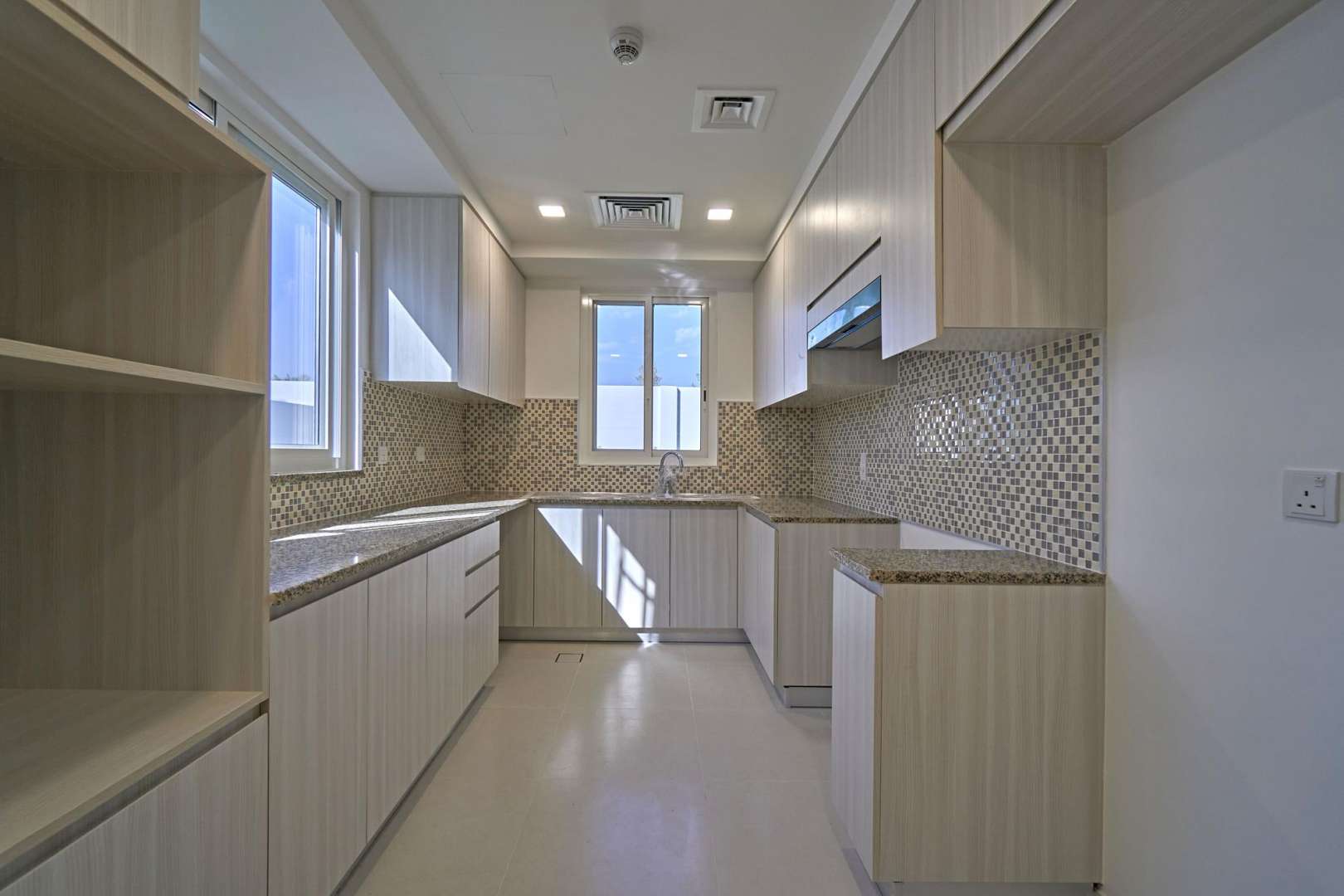 Elegant semi-detached townhouse exterior in Arabella 3, Mudon, with spacious driveway and garden