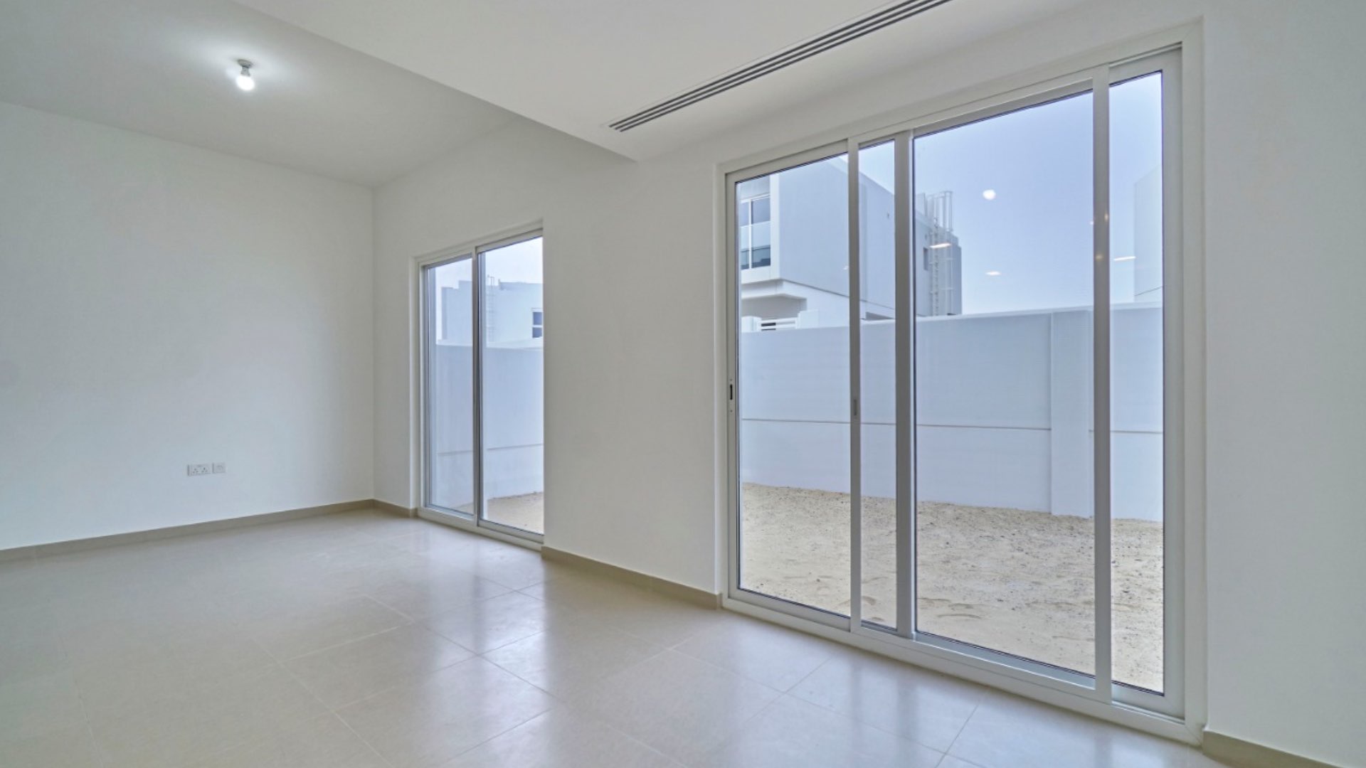 Modern living area in 4-bedroom townhouse, Arabella, Mudon, featuring sleek staircase and bright interior