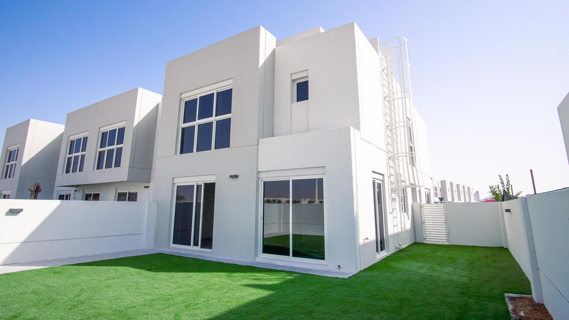 Front view of 4-bedroom townhouse with pergola in Arabella Townhouses, Mudon