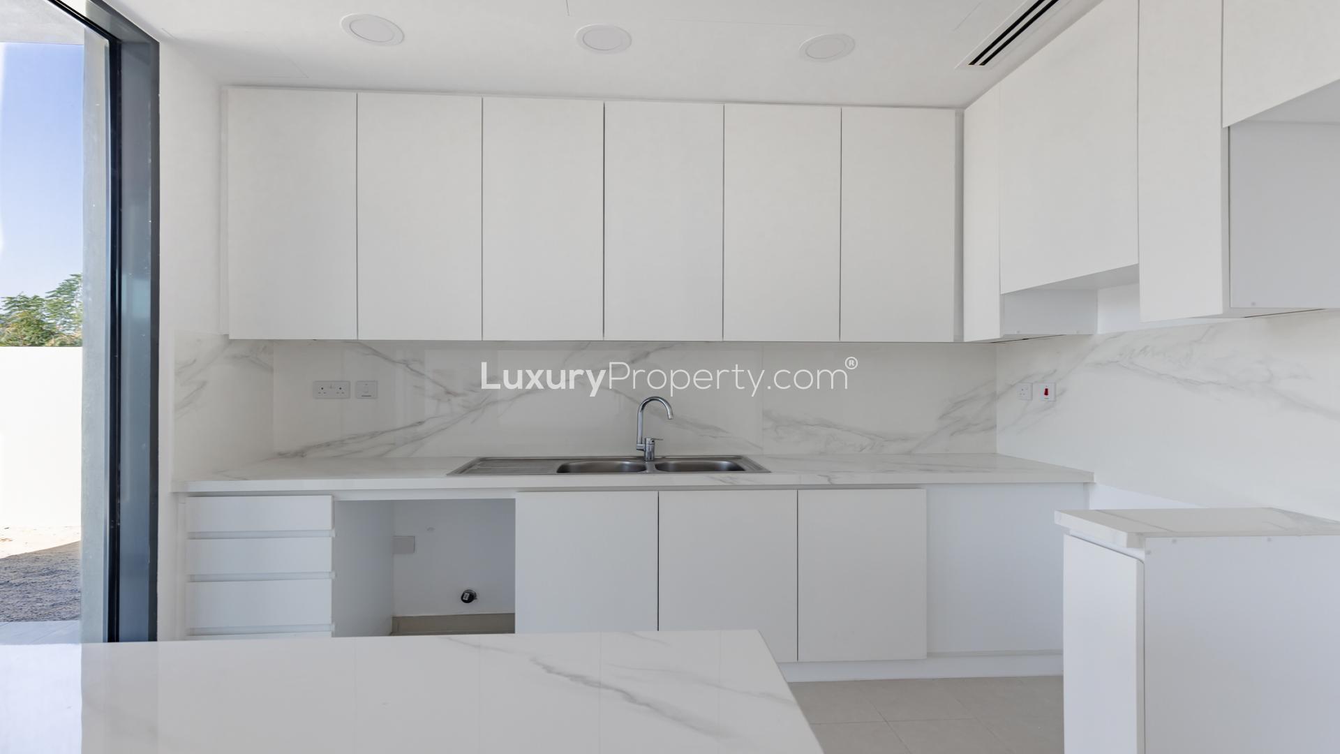 Bright, spacious living area with large windows in Cherrywoods townhouse, Dubai Land