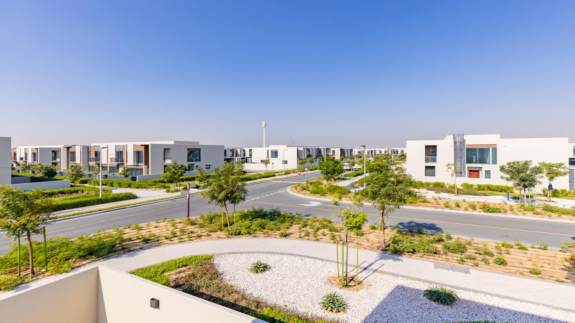 Modern kitchen in Cherrywoods townhouse, Dubai Land. Spacious, bright, with sleek white cabinetry