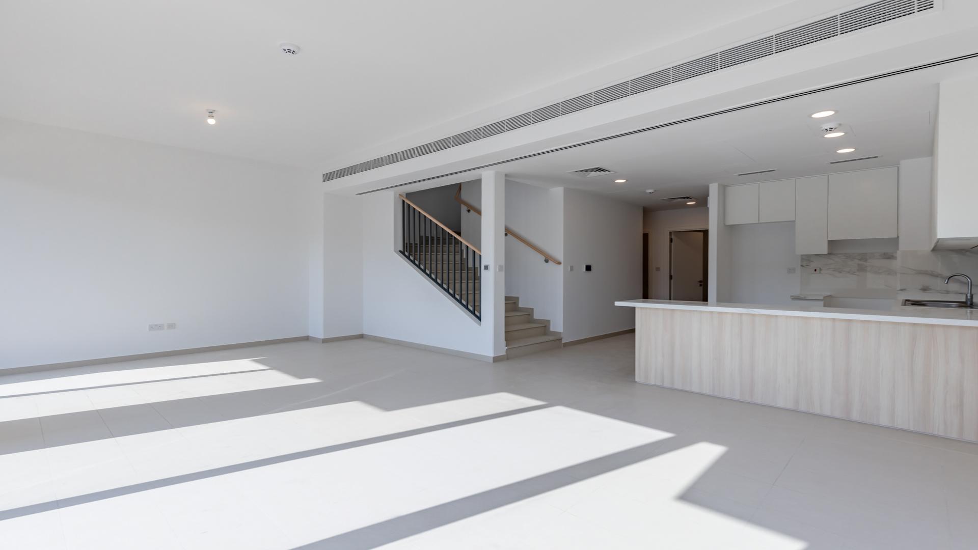 Modern 4-bedroom townhouse exterior in Cherrywoods, Dubai Land, available for rent